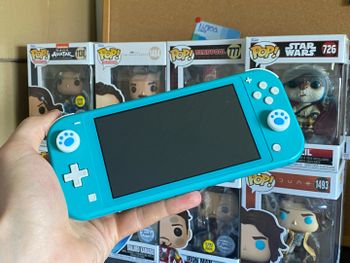 Nintendo Switch Lite, 32GB, Turquoise + Joystick Caps